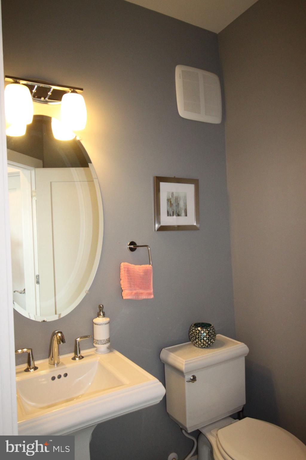 44738 Tiverton Square Ashburn, VA 20147 - Photo 21 of 66 a bathroom with a sink mirror and toilet
