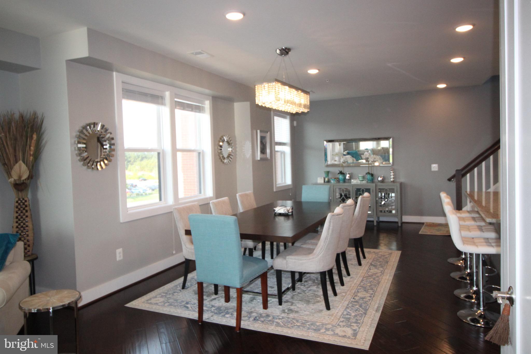 44738 Tiverton Square Ashburn, VA 20147 - Photo 22 of 66 a view of a dining room with furniture window and wooden floor