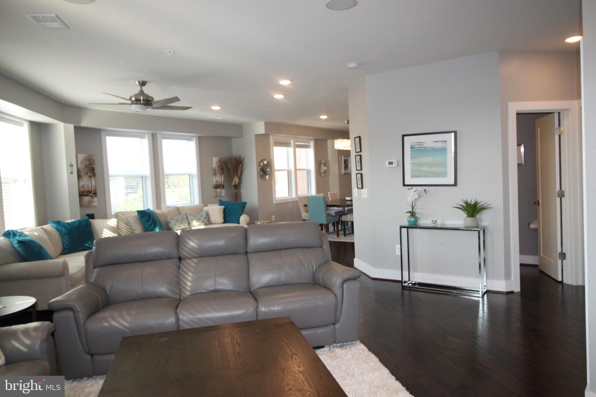44738 Tiverton Square Ashburn, VA 20147 - Photo 24 of 66 a living room with furniture and a large window