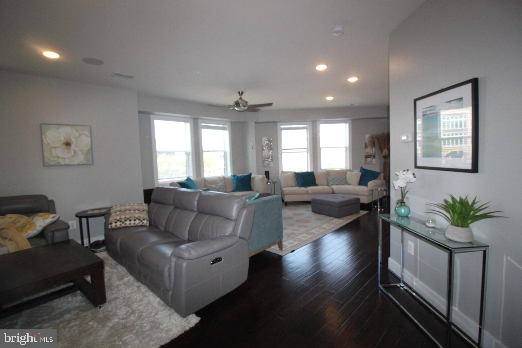 44738 Tiverton Square Ashburn, VA 20147 - Photo 25 of 66 a living room with furniture potted plant and a window