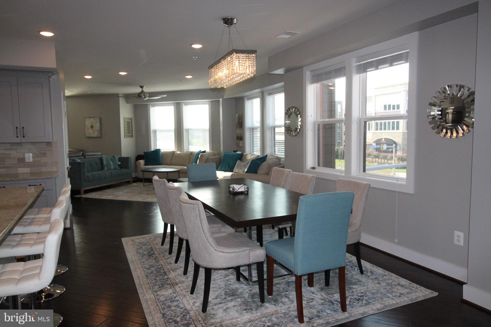 44738 Tiverton Square Ashburn, VA 20147 - Photo 27 of 66 a view of a a dining room with furniture window and wooden floor