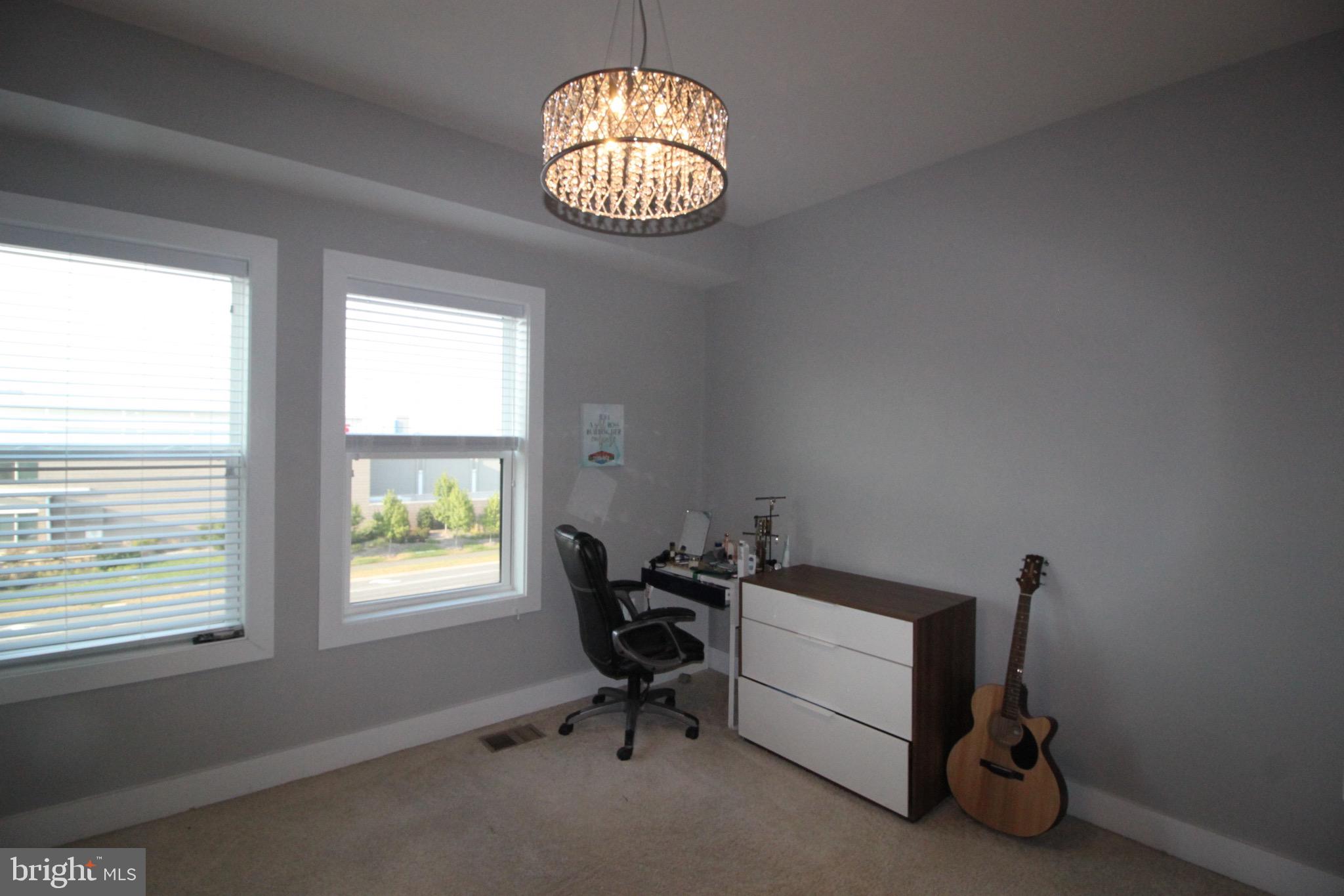44738 Tiverton Square Ashburn, VA 20147 - Photo 46 of 66 a room with a window and ceiling fan