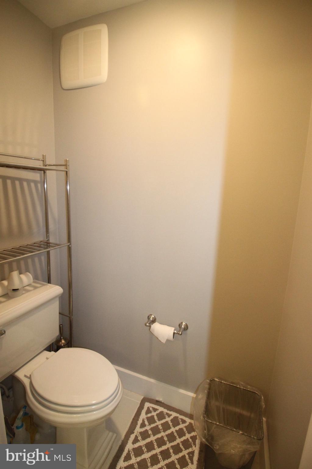 44738 Tiverton Square Ashburn, VA 20147 - Photo 49 of 66 a white toilet sitting next to a sink