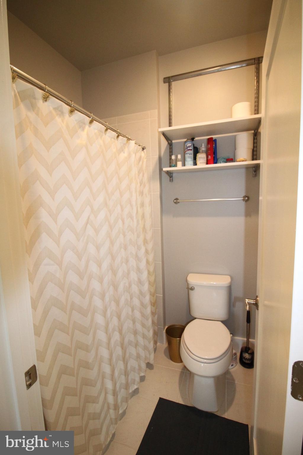 44738 Tiverton Square Ashburn, VA 20147 - Photo 53 of 66 a bathroom with a toilet and a sink