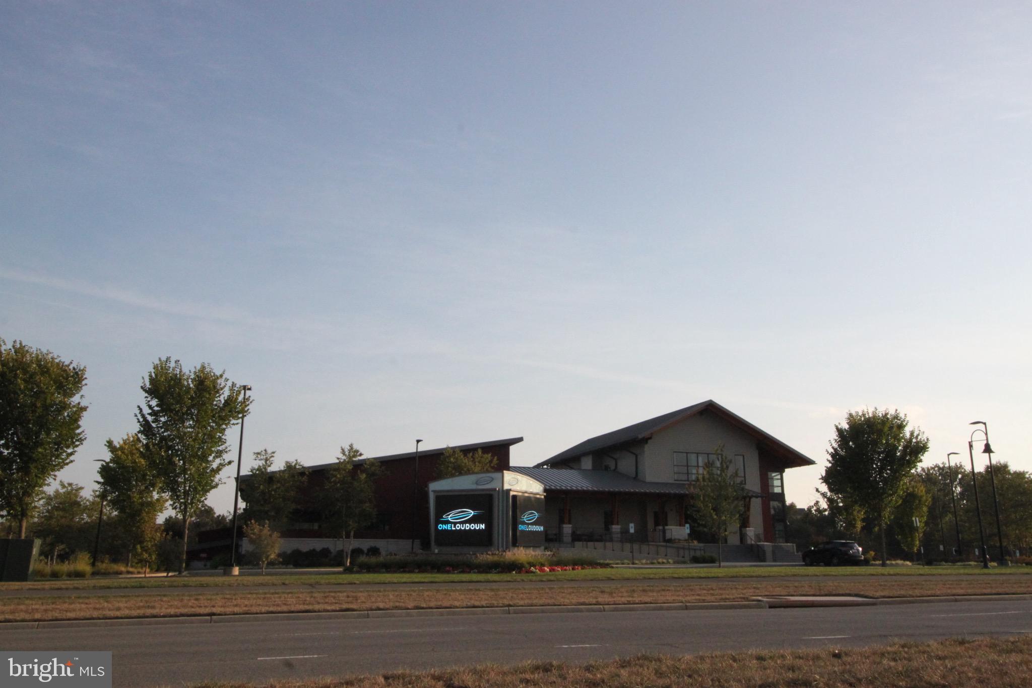 44738 Tiverton Square Ashburn, VA 20147 - Photo 59 of 66 a front view of a house with a yard
