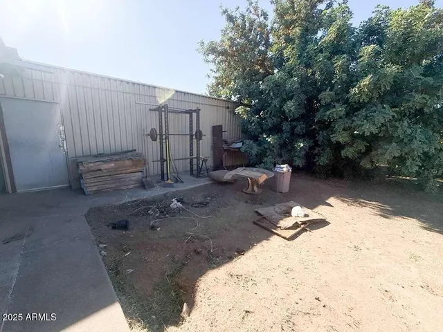 a view of a backyard with sitting area