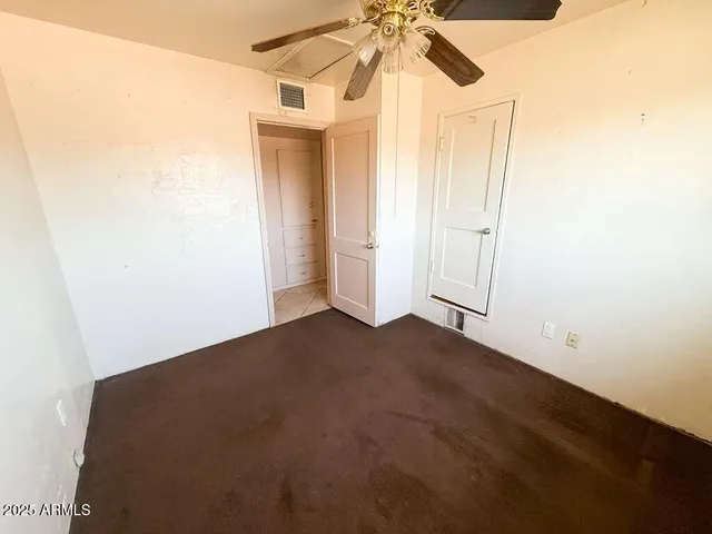 a white toilet sitting next to a bathroom sink
