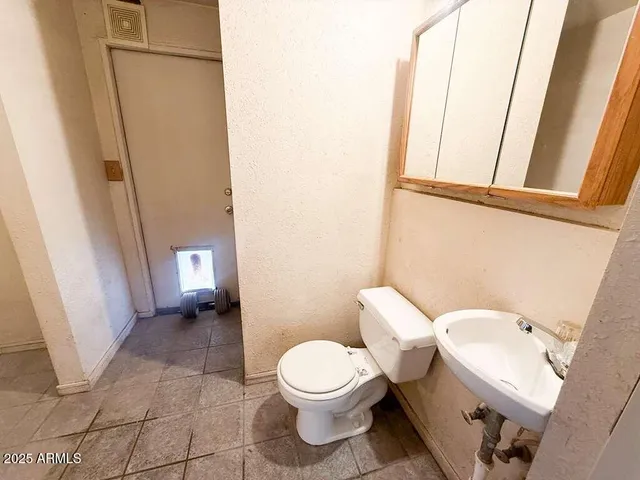 a bathroom with a sink toilet and tub