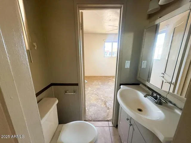 an empty room with a mirror