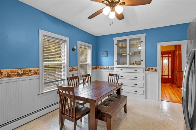 a view of a dining room with furniture and window