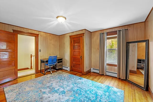 a view of a room with furniture wooden floor and window