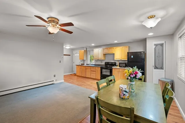 a living room with kitchen island furniture and a window