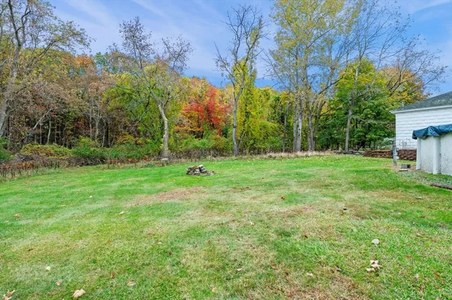 a backyard of a house with lots of green space
