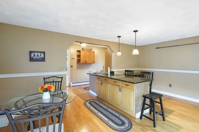a kitchen with stainless steel appliances granite countertop a sink and a stove