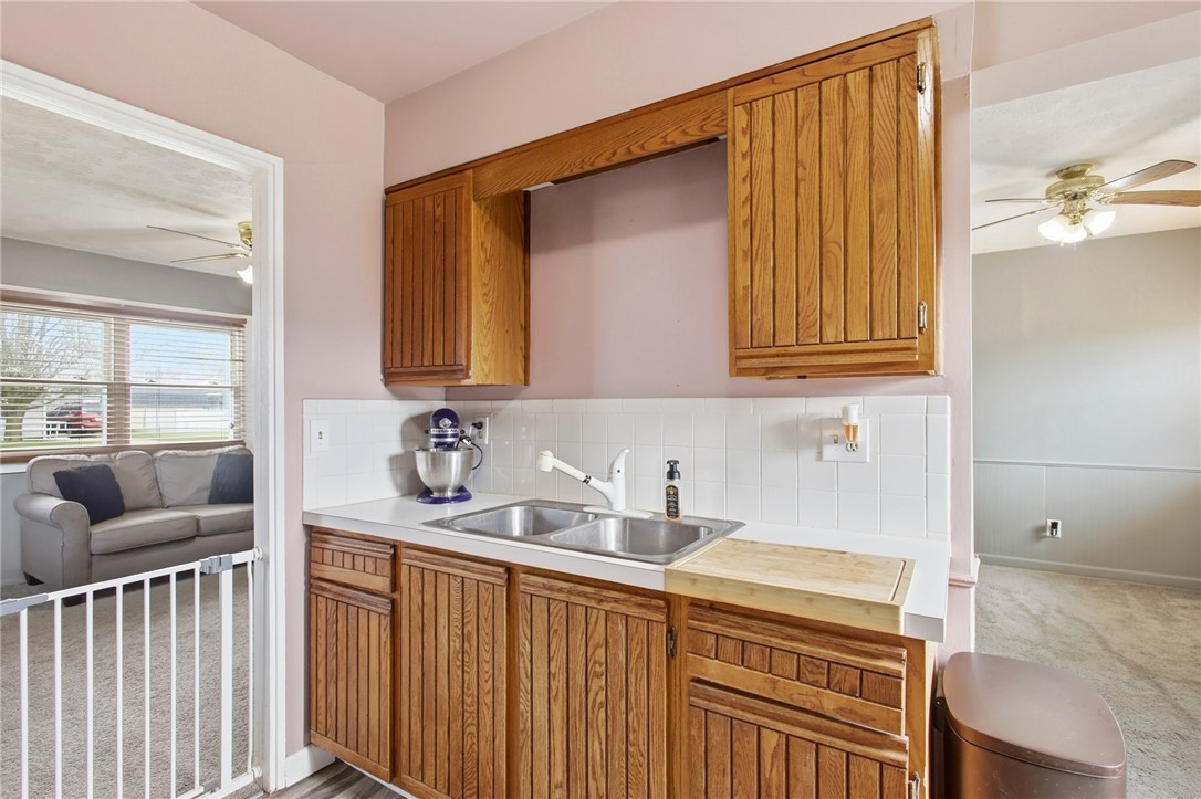 2745 Share Street Springfield, OH 45505 - Photo 13 of 28 Functional kitchen with warm cabinetry offers practical living spaces.