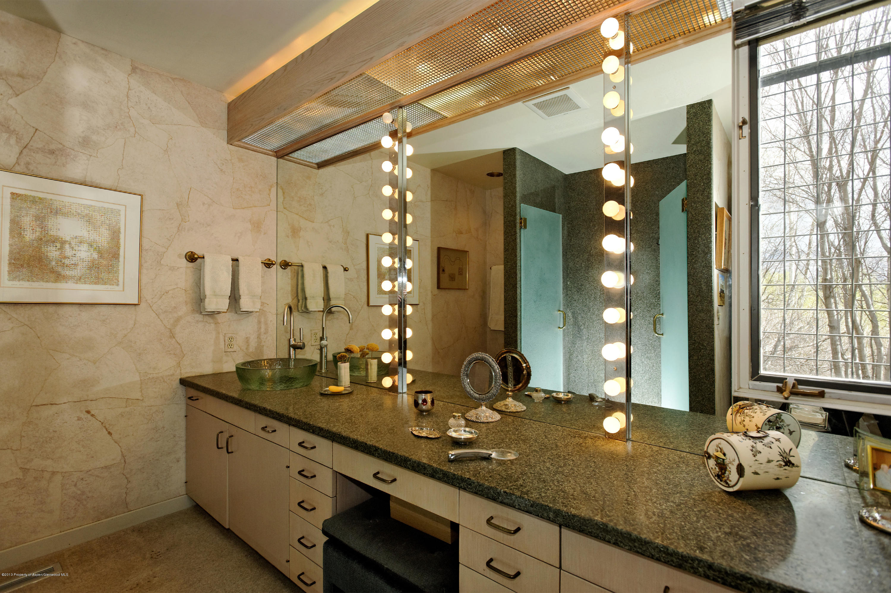 2021 Maroon Creek Road Aspen, CO 81611 - Photo 11 of 21 a bathroom with double sink and a mirror