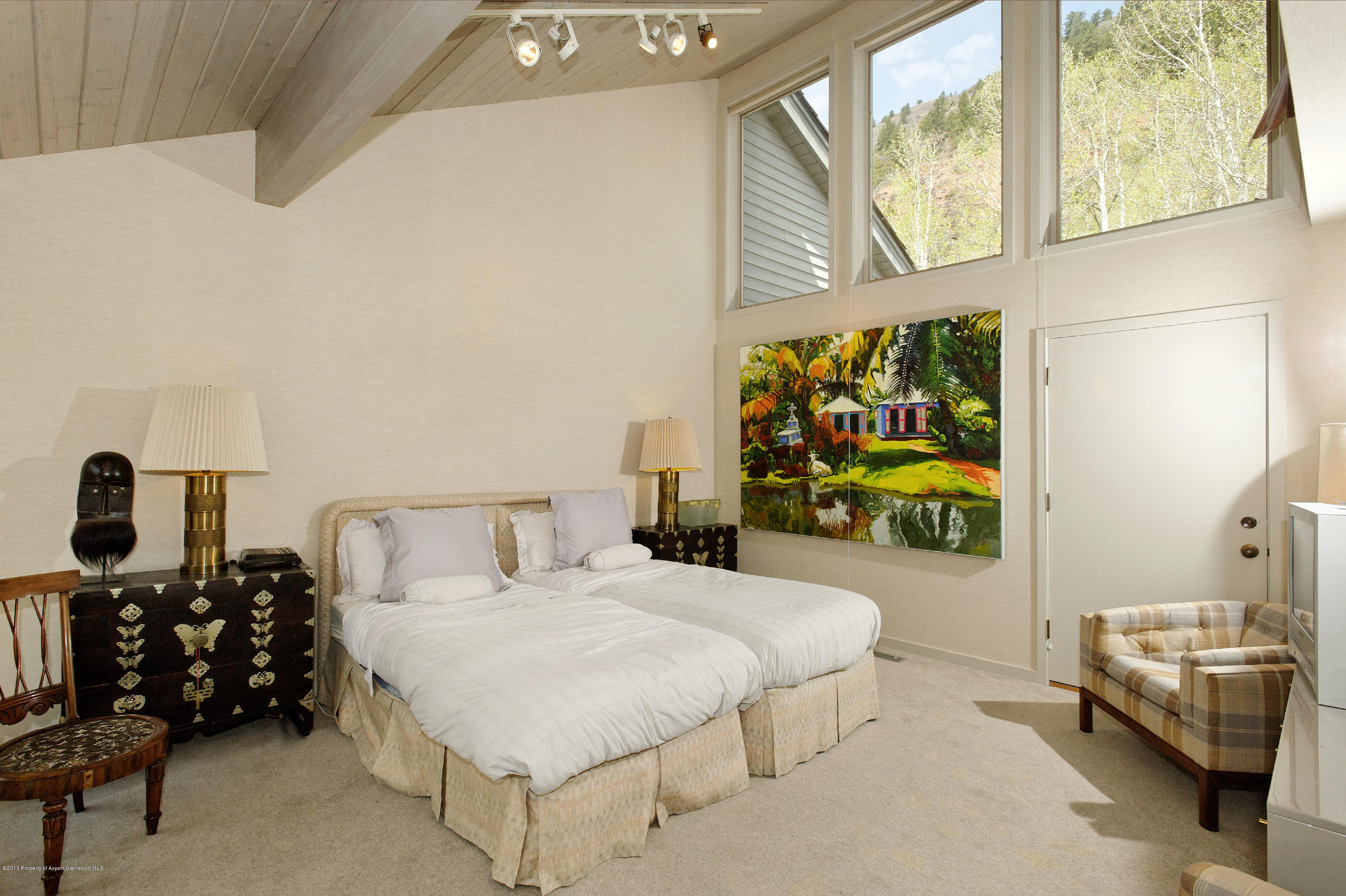 2021 Maroon Creek Road Aspen, CO 81611 - Photo 12 of 21 a bedroom with a bed and dresser