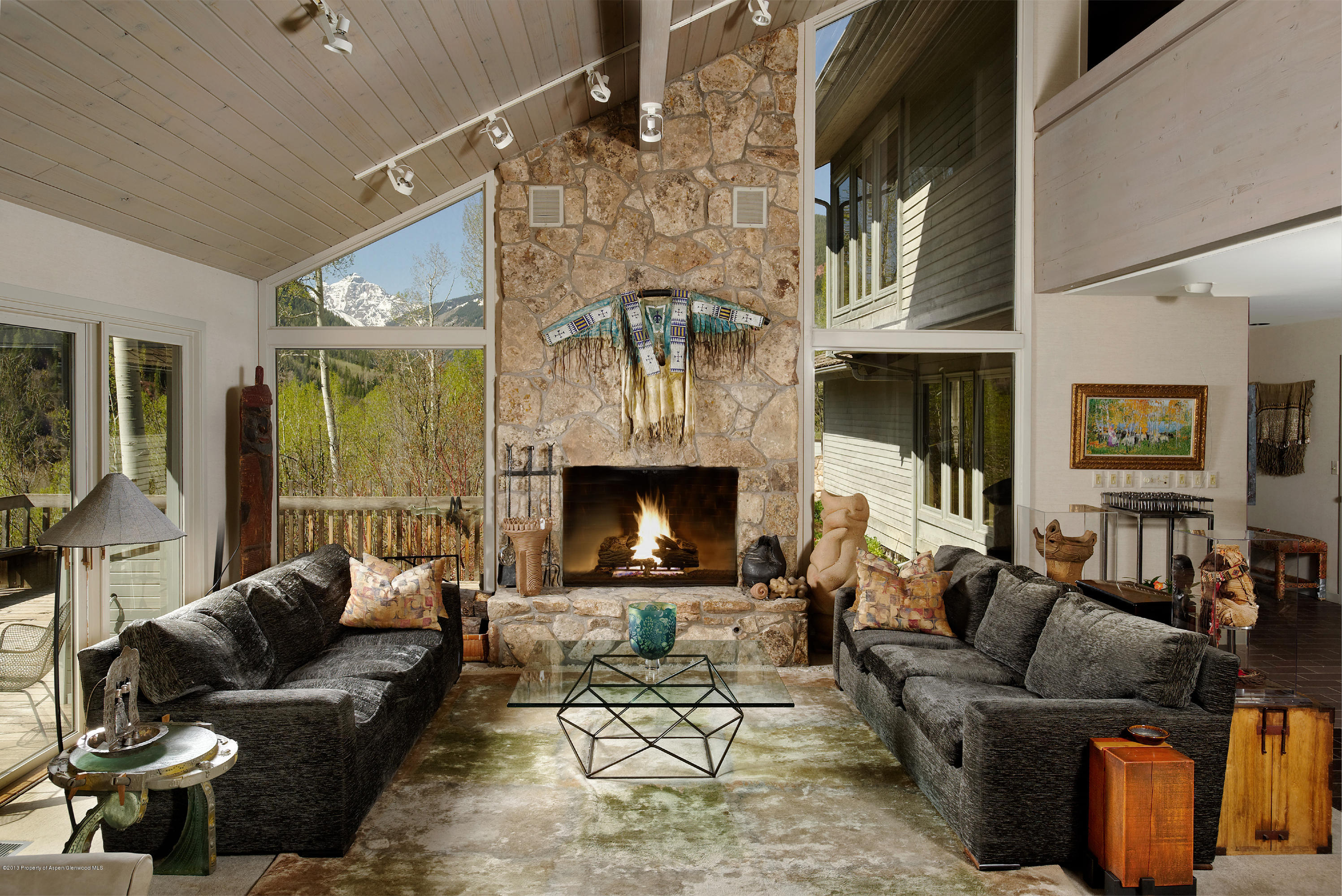 2021 Maroon Creek Road Aspen, CO 81611 - Photo 3 of 21 a living room with furniture and a fireplace