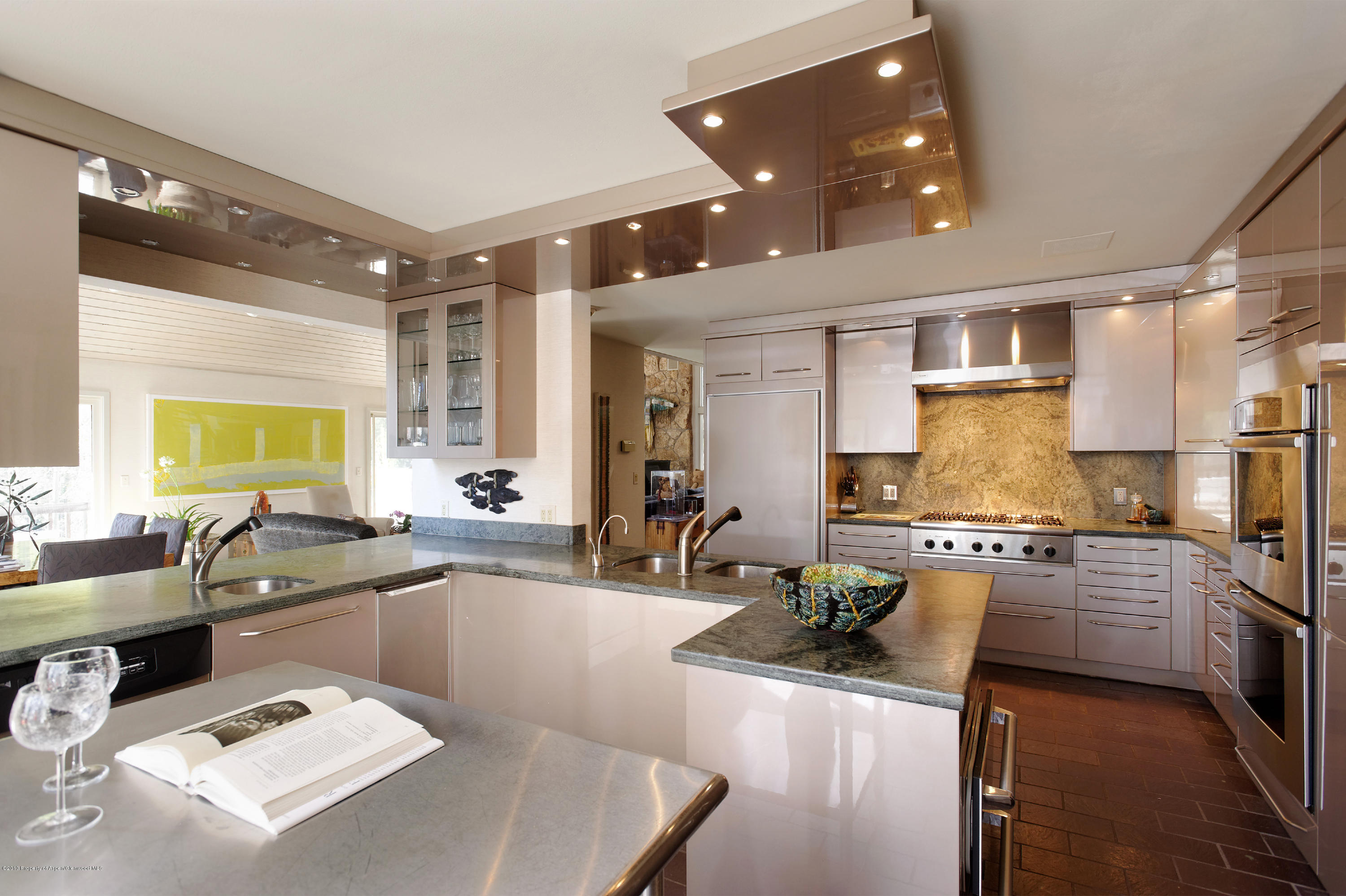 2021 Maroon Creek Road Aspen, CO 81611 - Photo 6 of 21 a kitchen with stainless steel appliances granite countertop a sink a stove and a refrigerator