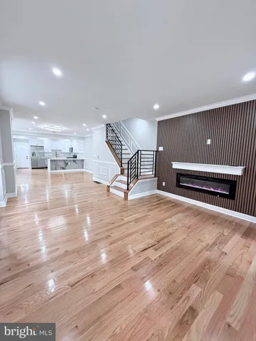 a kitchen with stainless steel appliances a refrigerator sink and microwave