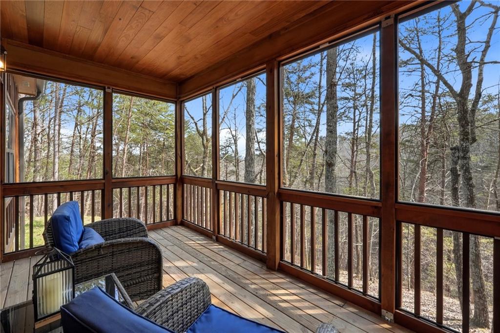 1041 Astro Court Northeast Ranger, GA 30734 - Photo 41 of 52 a balcony with wooden floor and furniture