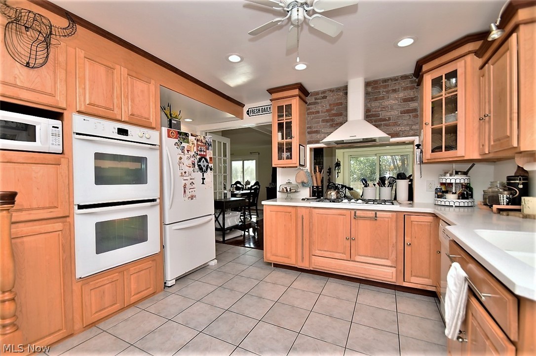 8790 Avery Road Broadview Heights, OH 44147 - Photo 6 of 35 The kitchen has tons of storage. The maple cabinets, cherry colored inlays, and seamless solid surface counters tie together the original charm of this home with all the sophisticated updates found throughout.