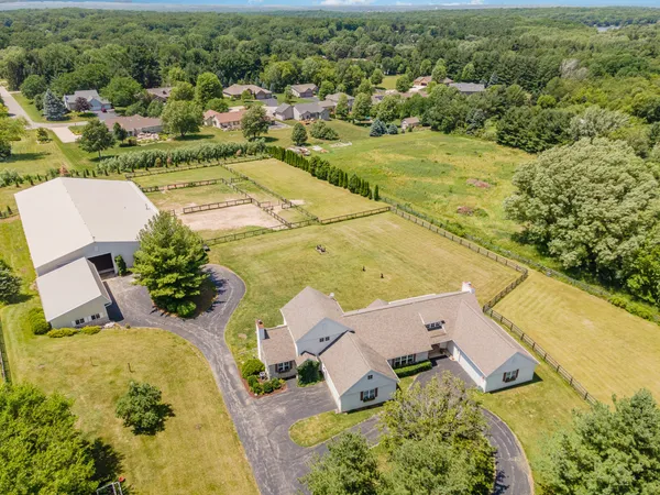 an aerial view of residential houses with outdoor space