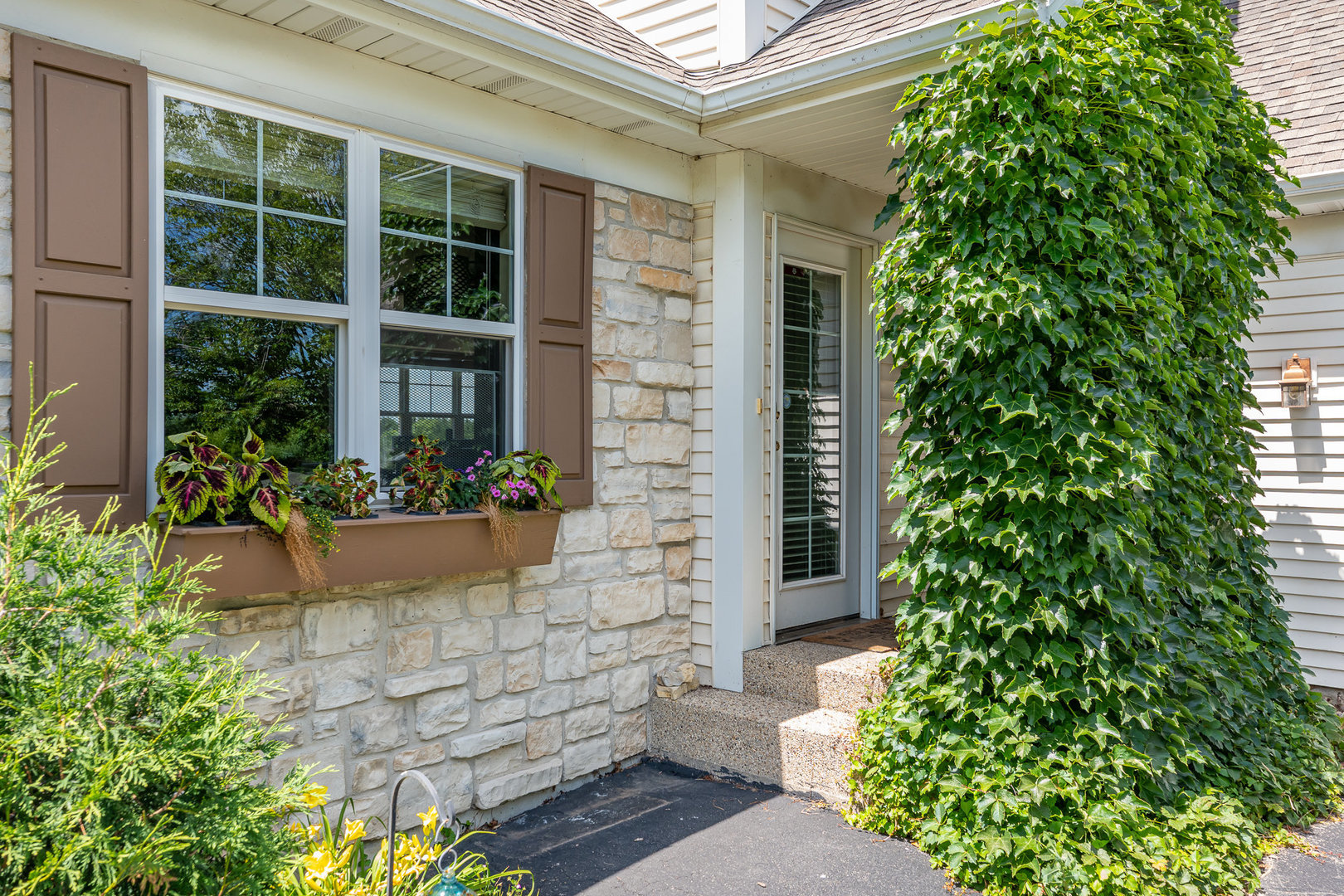 5284 Harvey Road Caledonia, IL 61011 - Photo 8 of 57 a front view of a house with plants