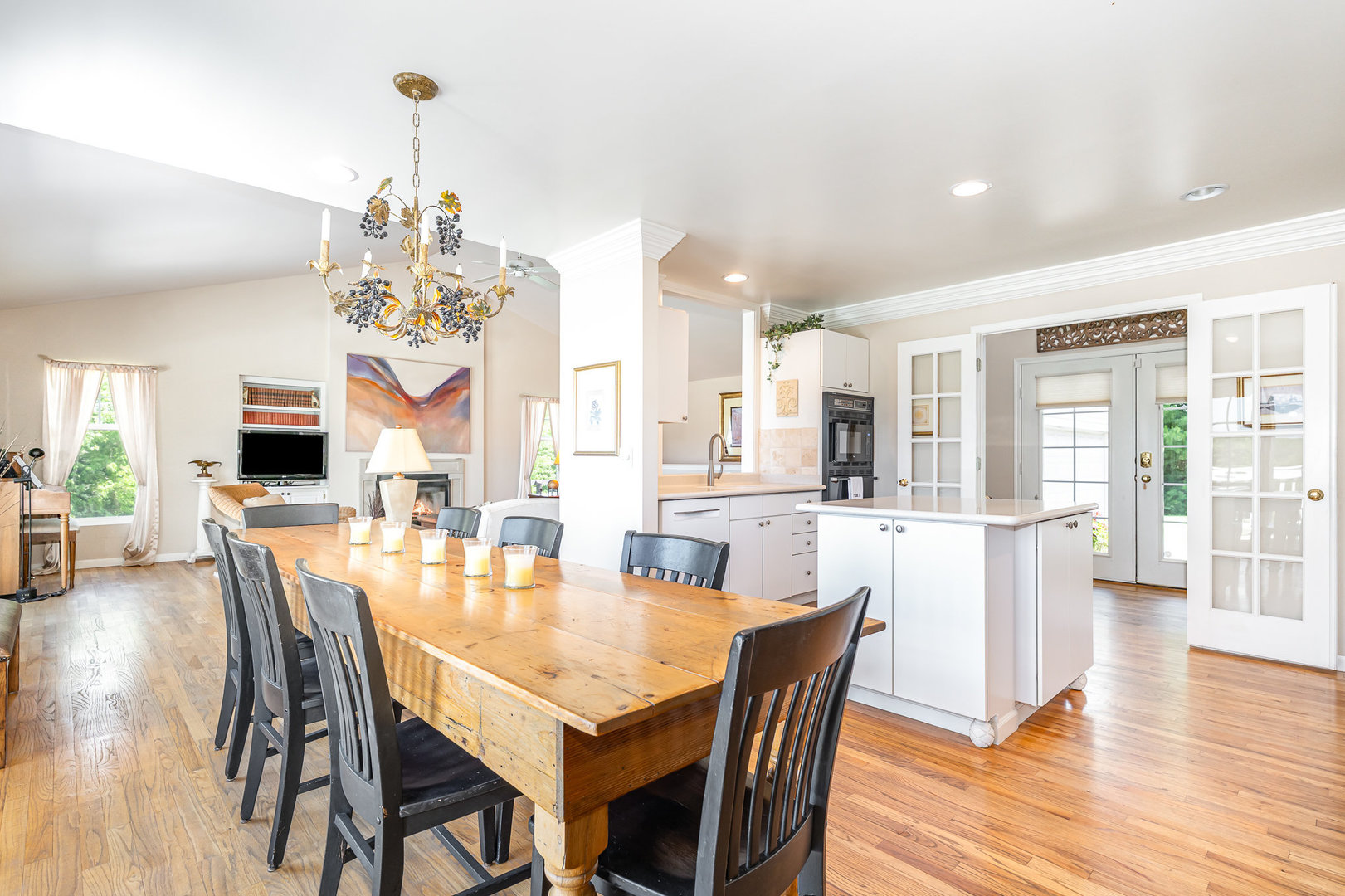 5284 Harvey Road Caledonia, IL 61011 - Photo 9 of 57 a view of a dining room and livingroom with furniture wooden floor a chandelier