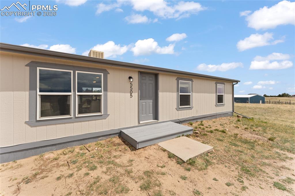 5505 Whipshaw Road Peyton, CO 80831 - Photo 2 of 39 a view of a backyard of a house