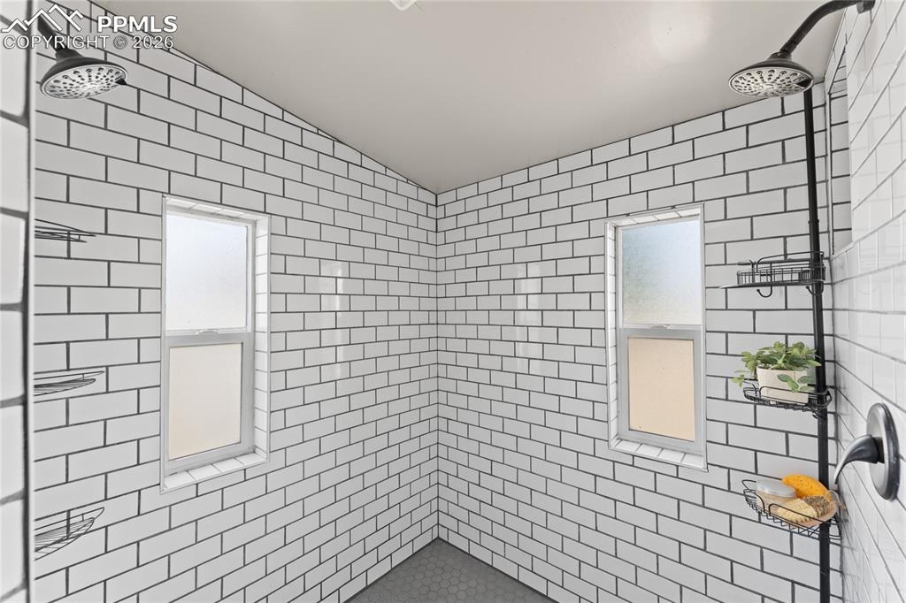 5505 Whipshaw Road Peyton, CO 80831 - Photo 21 of 39 a bathroom with a shower
