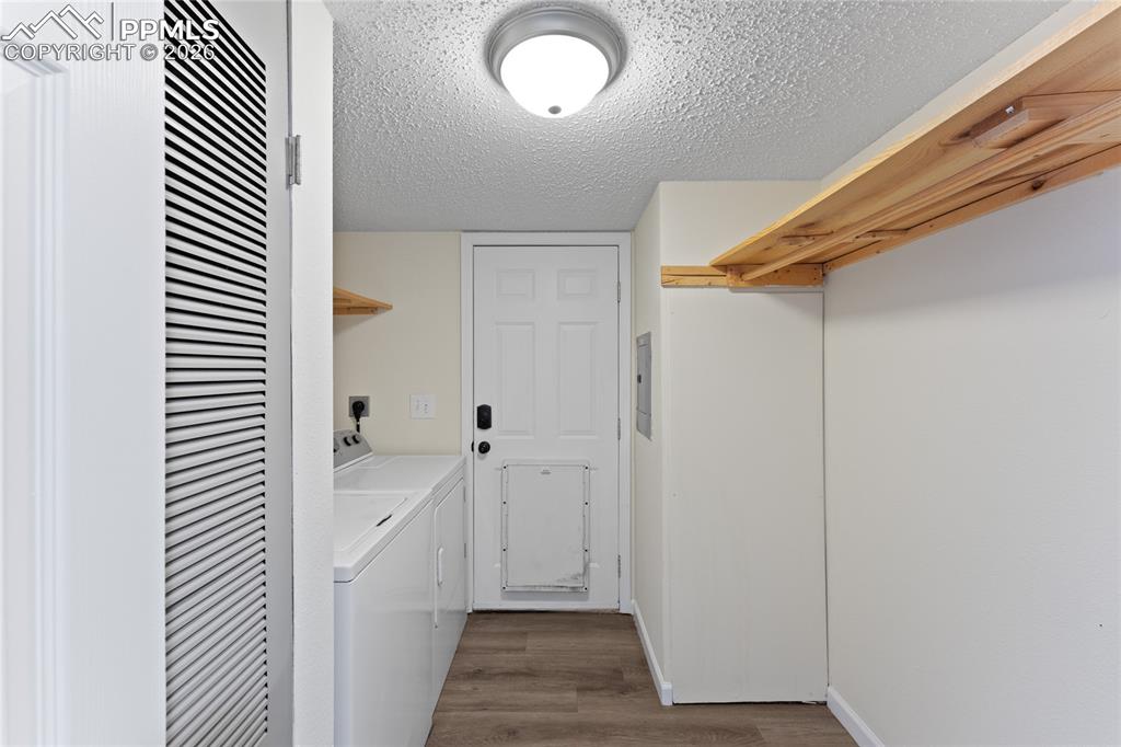 5505 Whipshaw Road Peyton, CO 80831 - Photo 32 of 39 a view of a hallway with wooden floor and staircase