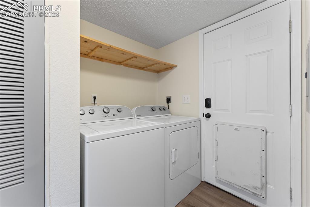 5505 Whipshaw Road Peyton, CO 80831 - Photo 33 of 39 a utility room with dryer and washer