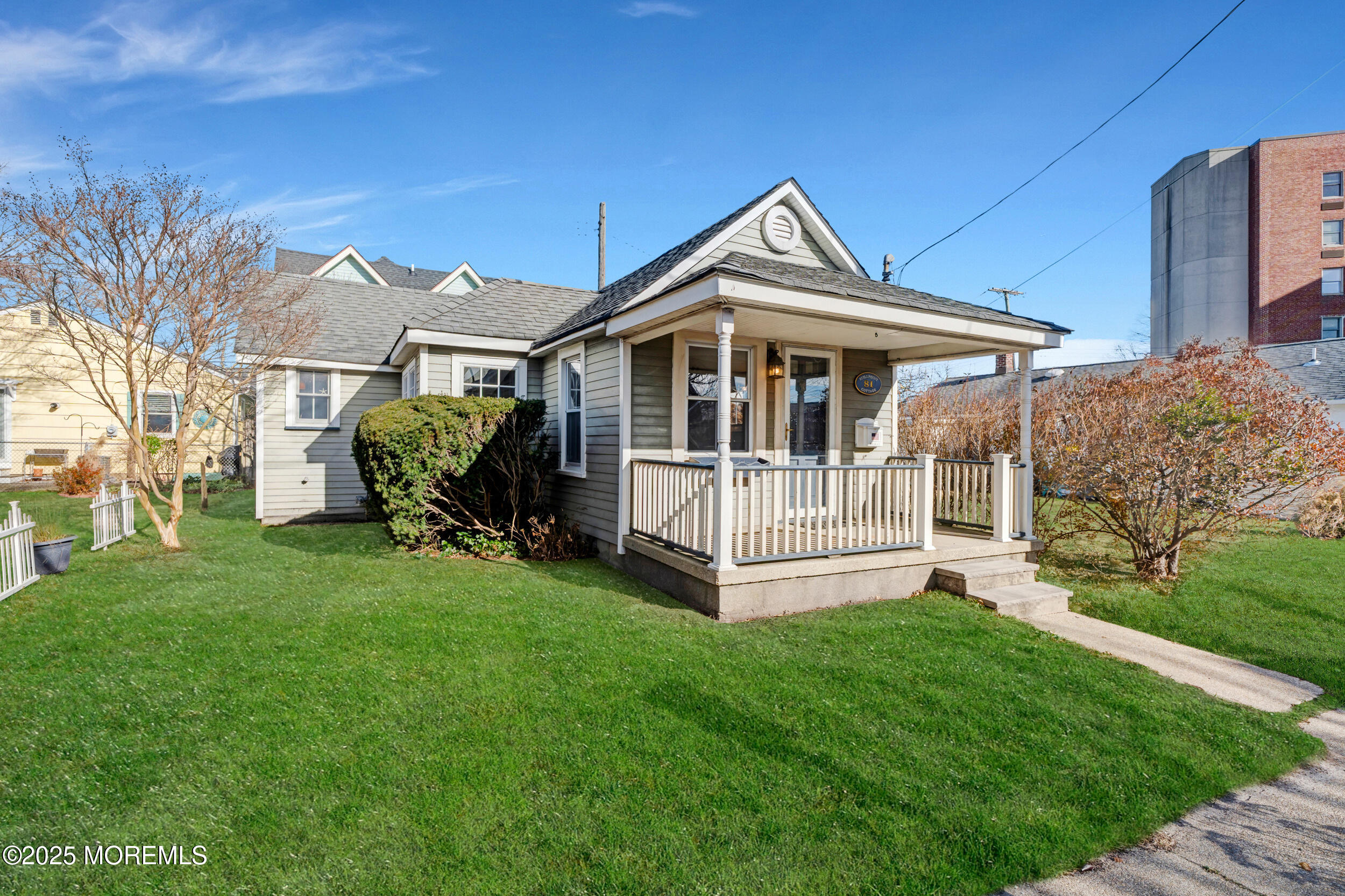 81 Inskip Avenue Ocean Grove, NJ 07756 - Photo 1 of 86 a front view of a house with a garden