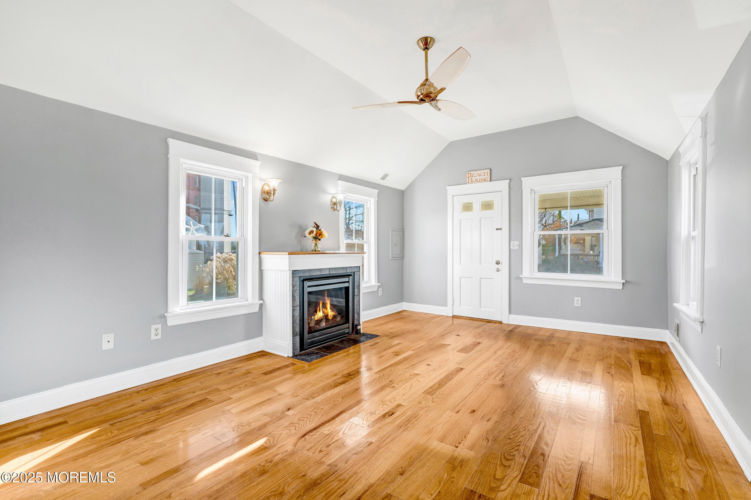 81 Inskip Avenue Ocean Grove, NJ 07756 - Photo 12 of 86 a view of empty room with a fireplace and wooden floor