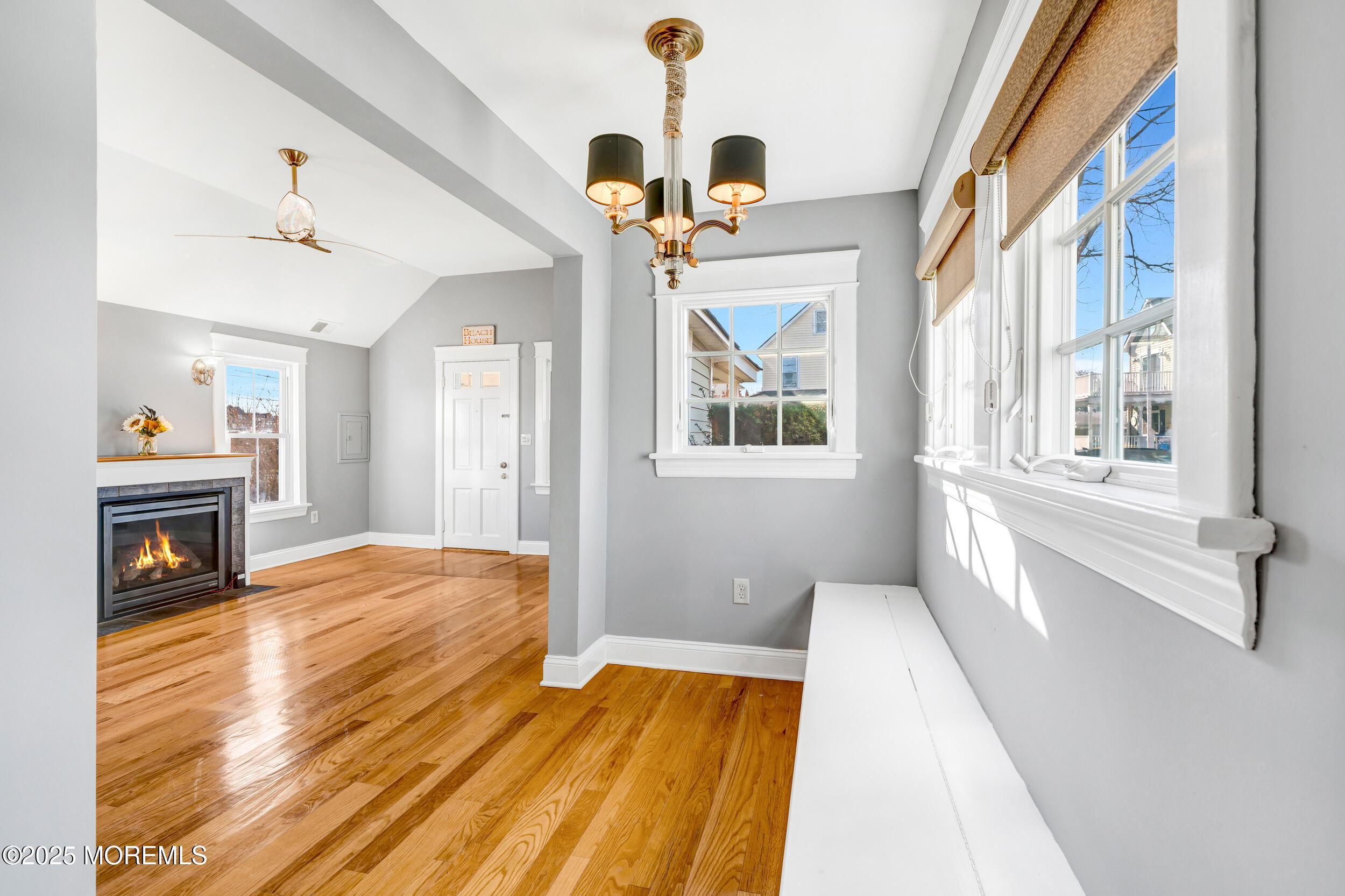 81 Inskip Avenue Ocean Grove, NJ 07756 - Photo 15 of 86 a view of an empty room with wooden floor fireplace and a window