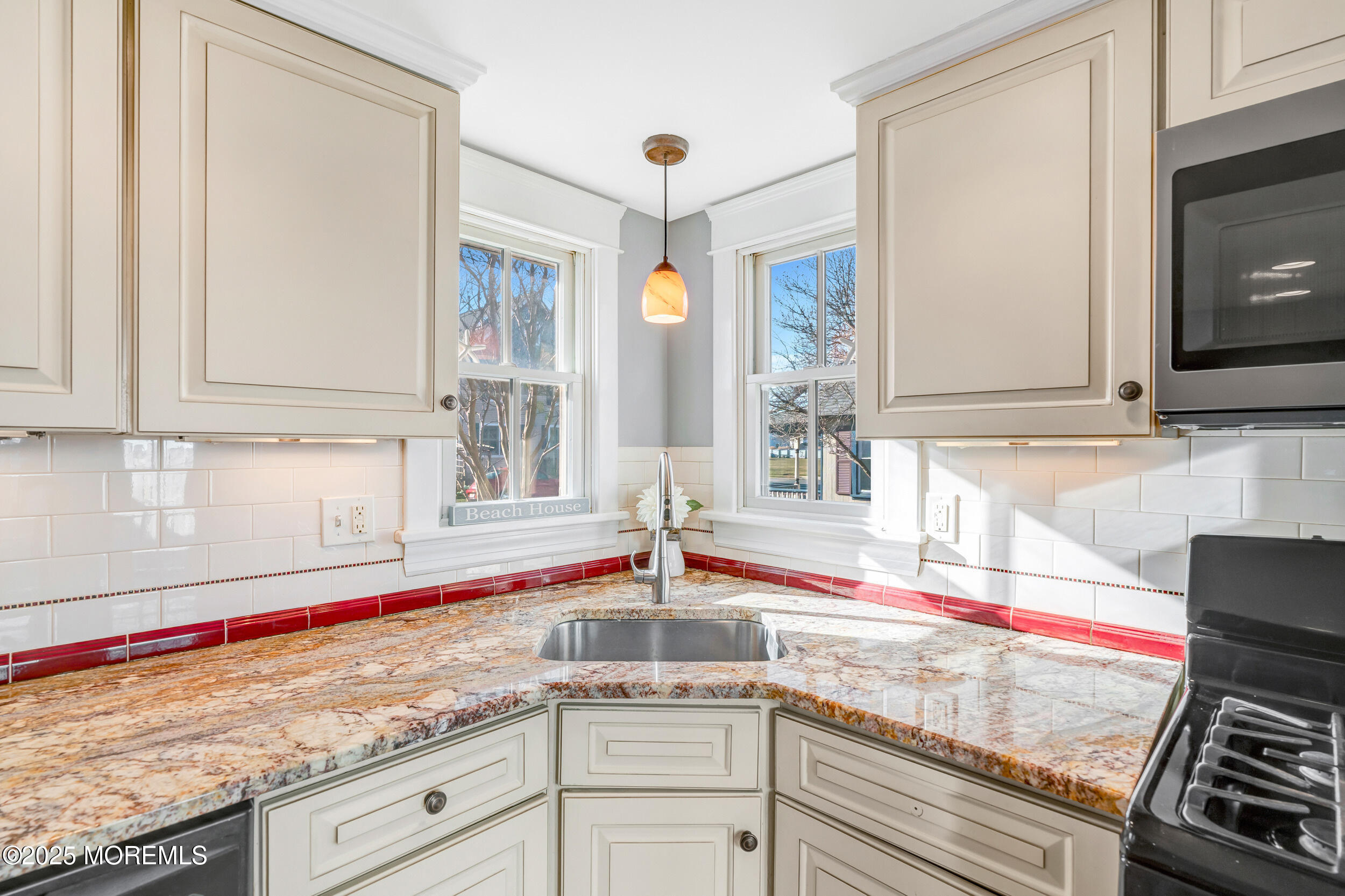 81 Inskip Avenue Ocean Grove, NJ 07756 - Photo 24 of 86 a kitchen with stainless steel appliances granite countertop a sink and a stove