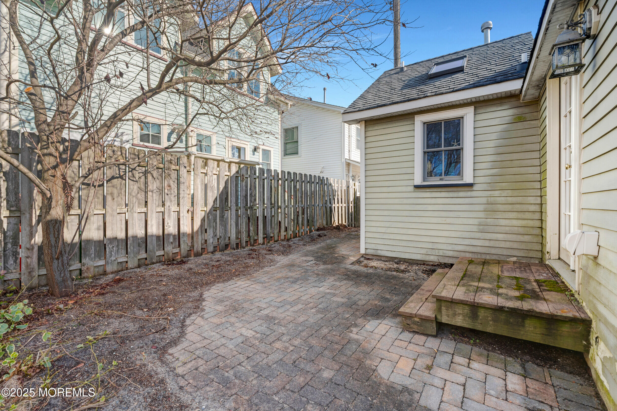 81 Inskip Avenue Ocean Grove, NJ 07756 - Photo 28 of 86 a backyard of a house with a parked car