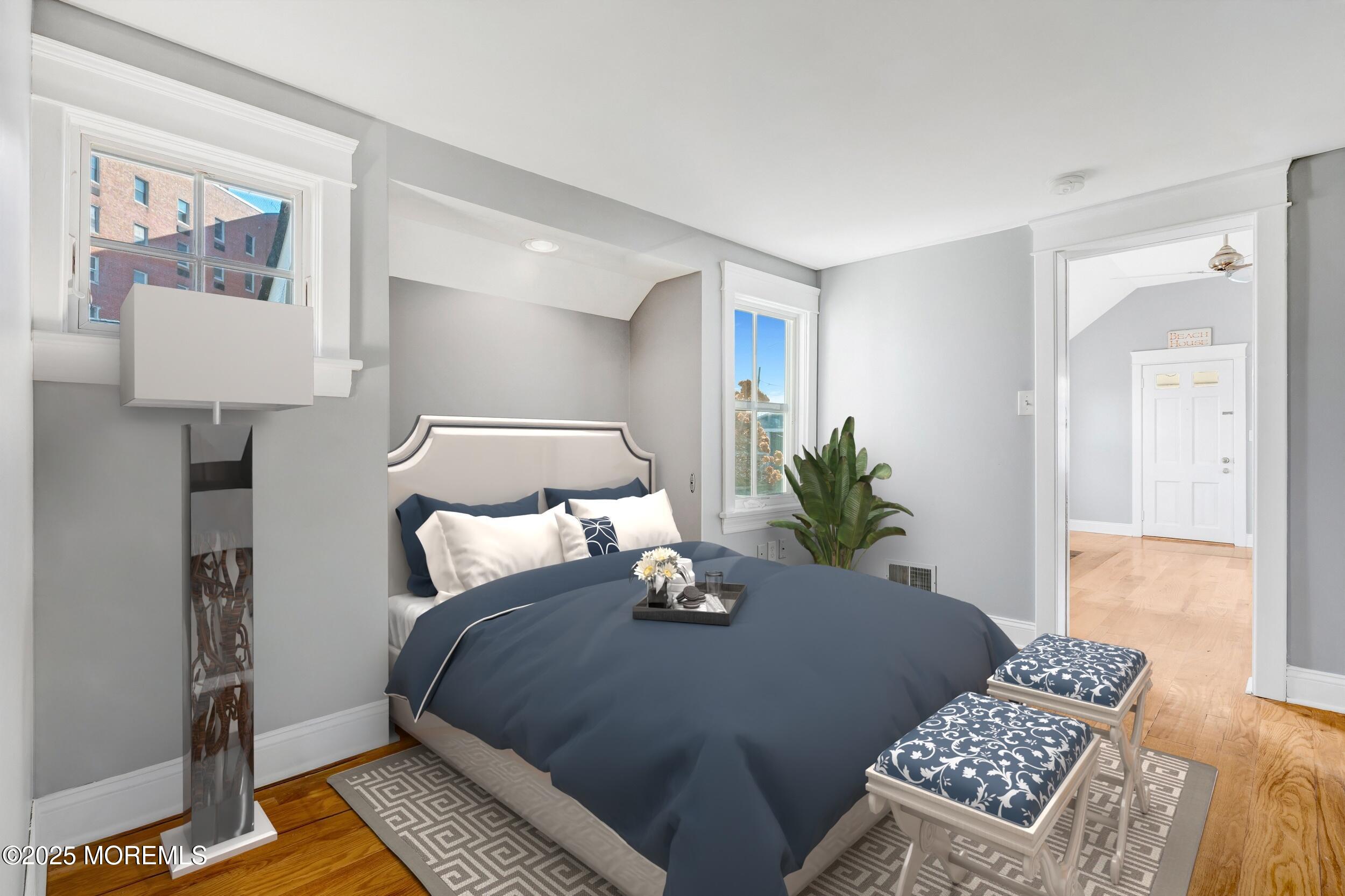 81 Inskip Avenue Ocean Grove, NJ 07756 - Photo 32 of 86 a bedroom with a bed and wooden floor