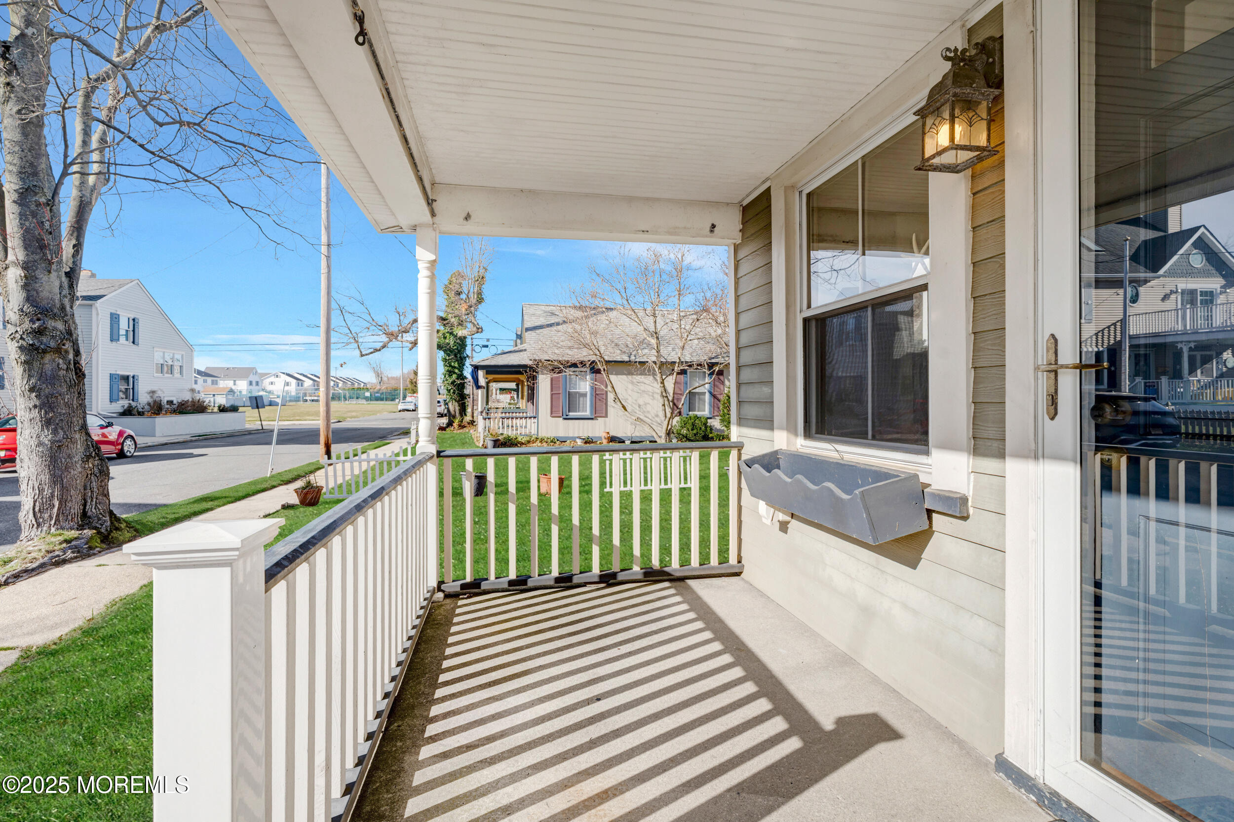 81 Inskip Avenue Ocean Grove, NJ 07756 - Photo 6 of 86 a view of a balcony with car parked