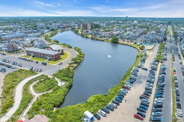 a view of a swimming pool with seating area
