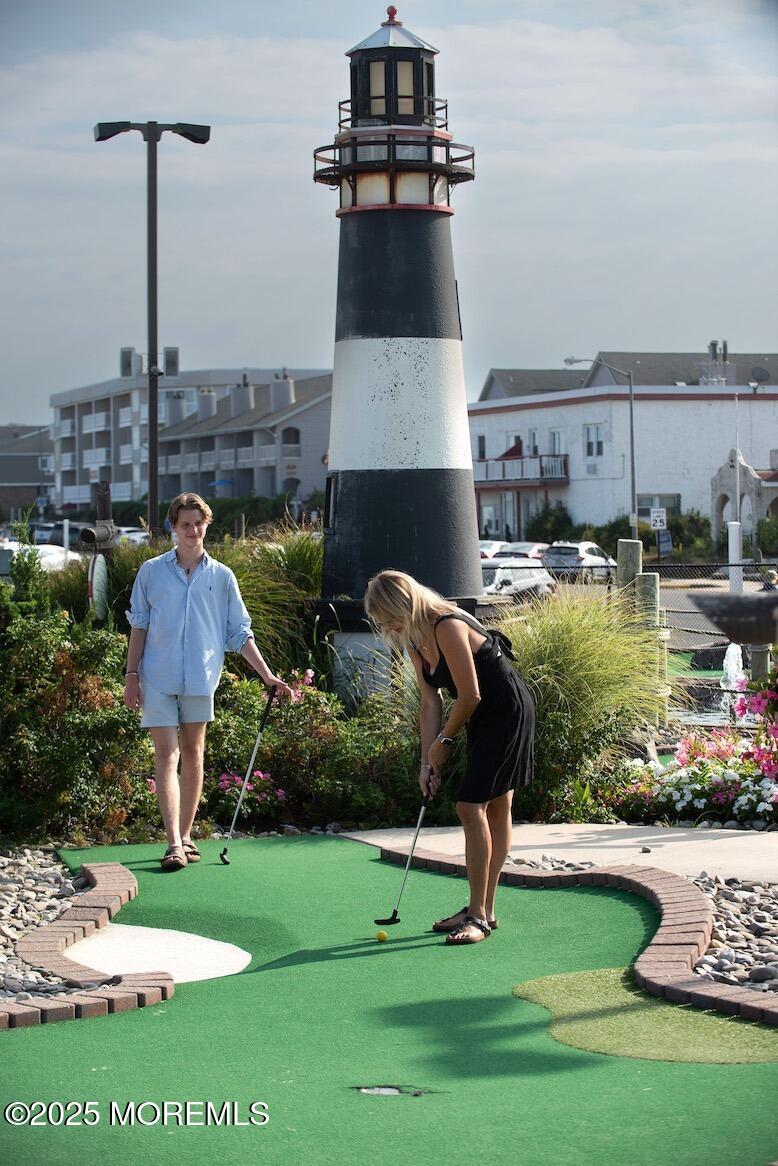 81 Inskip Avenue Ocean Grove, NJ 07756 - Photo 84 of 86 a view of a lake with a big yard and potted plants
