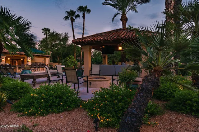 a view of a backyard with sitting area