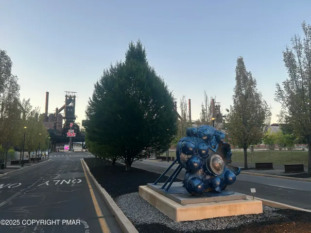 a view of a water fountain in front of the house