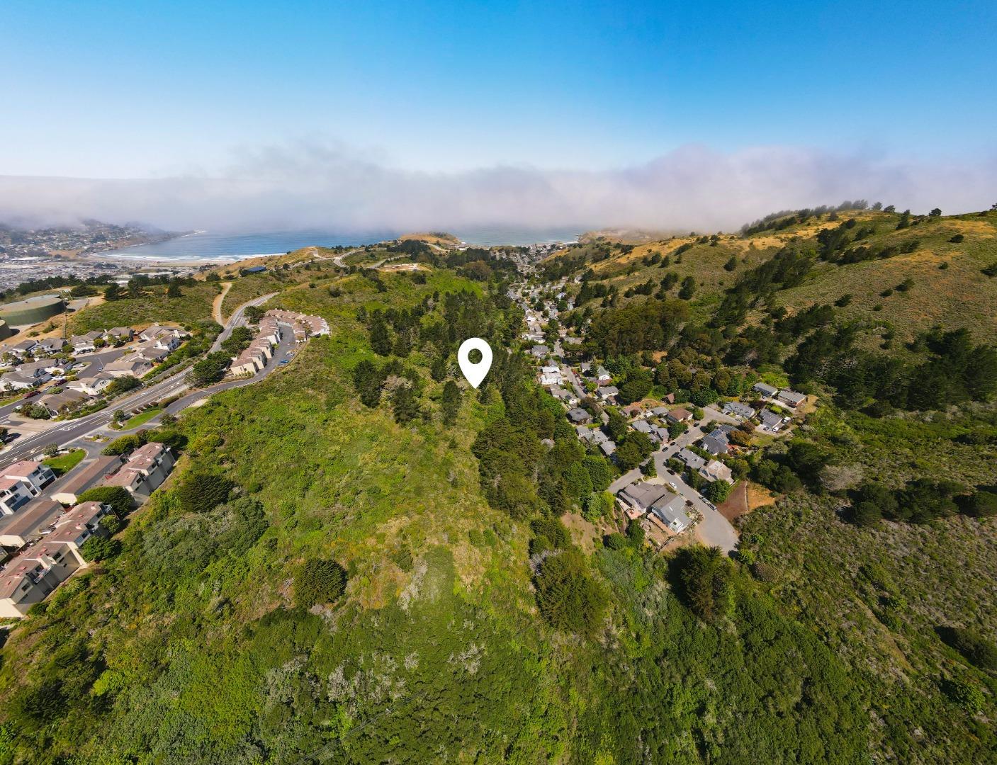 0 Oddstad Boulevard Pacifica, CA 94044 - Photo 2 of 4 an aerial view of residential houses with outdoor space and trees