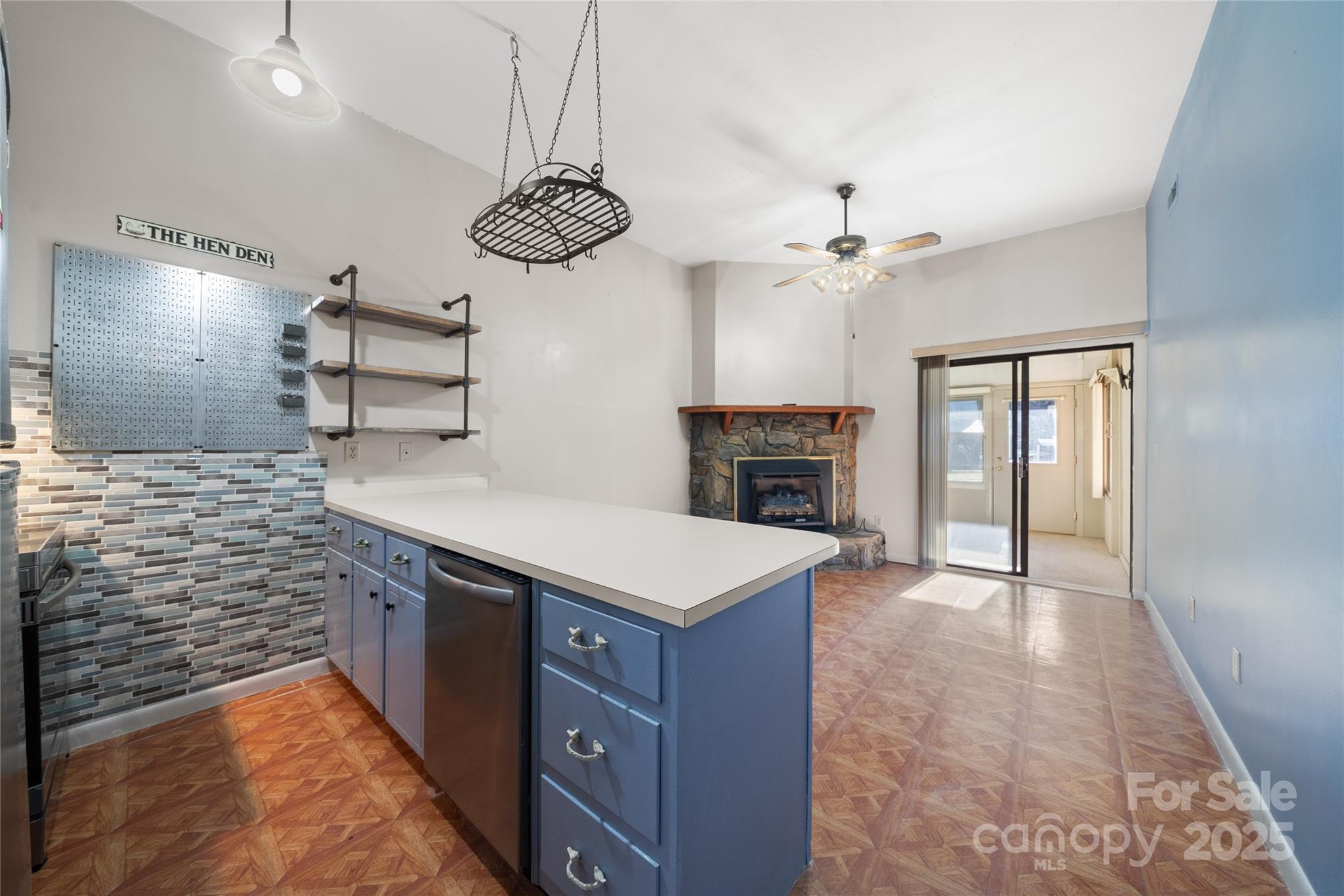 94 Market Street Maggie Valley, NC 28751 - Photo 12 of 40 an open kitchen with a sink and a stove top oven