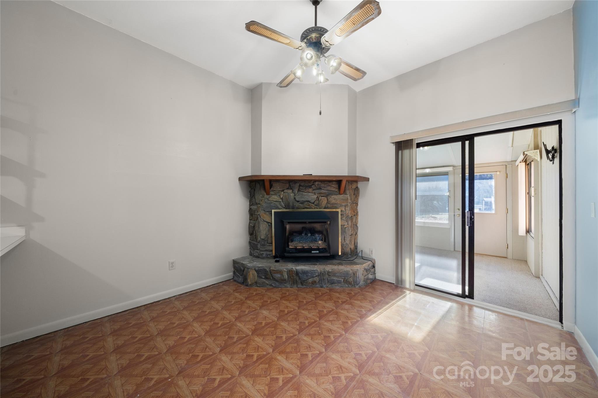 94 Market Street Maggie Valley, NC 28751 - Photo 14 of 40 a view of an empty room with a fireplace