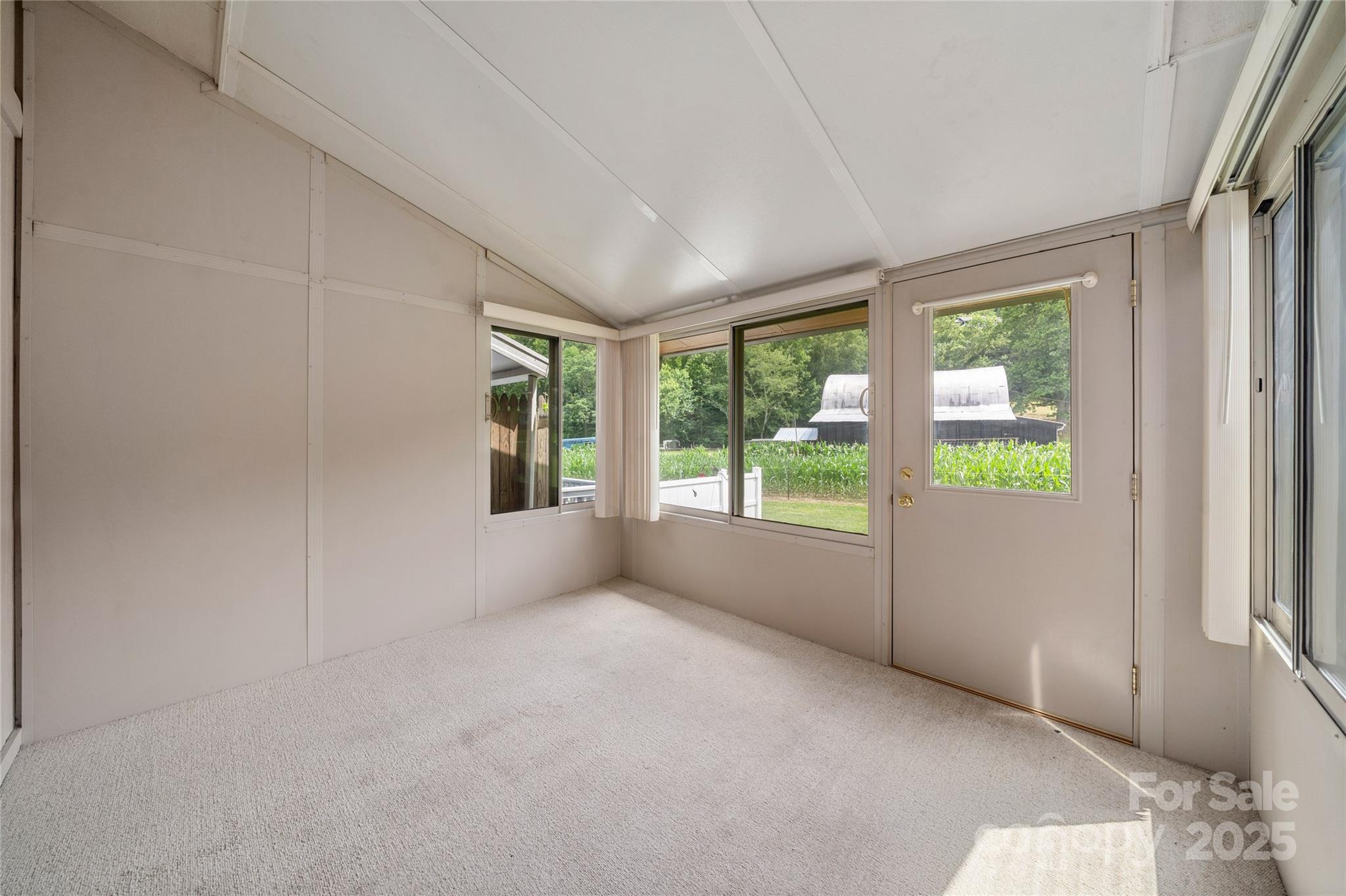 94 Market Street Maggie Valley, NC 28751 - Photo 22 of 40 a view of an empty room with a window