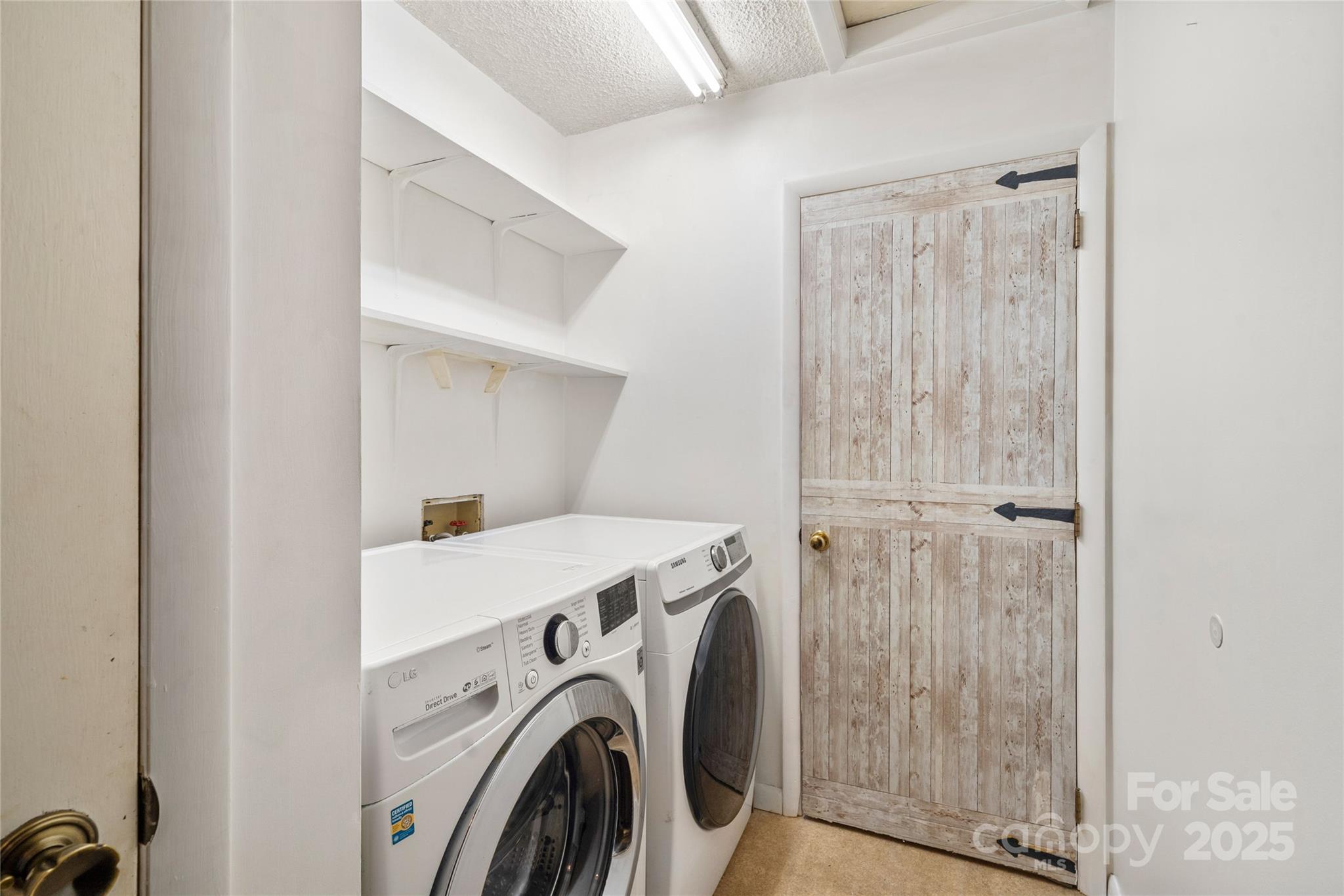 94 Market Street Maggie Valley, NC 28751 - Photo 31 of 40 a utility room with dryer and washer