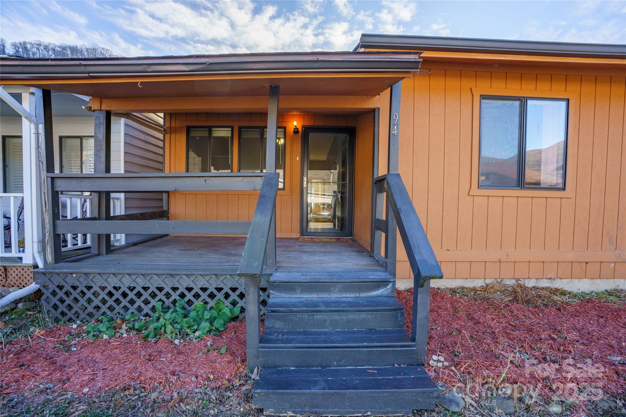 94 Market Street Maggie Valley, NC 28751 - Photo 33 of 40 a front view of a house with a yard